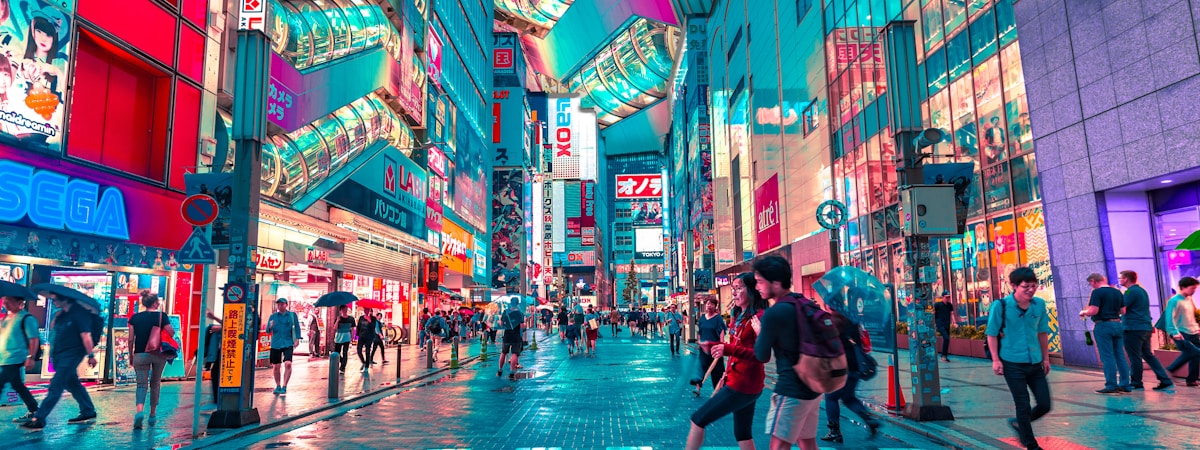 Tokyo skyline at night featuring the illuminated Tokyo Tower surrounded by high-rise buildings